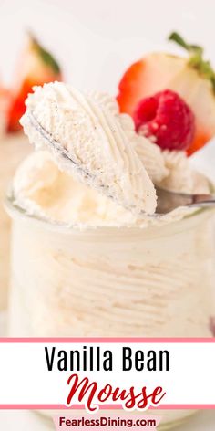 vanilla bean mousse with whipped cream and strawberries on top in a glass jar