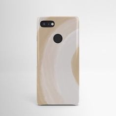 an iphone case with a white and beige swirl design on the back, in front of a gray background