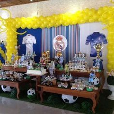 a soccer themed party with balloons and decorations