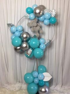 a bunch of balloons that are in the shape of a letter k on a table