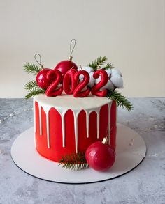 a red and white cake with decorations on top