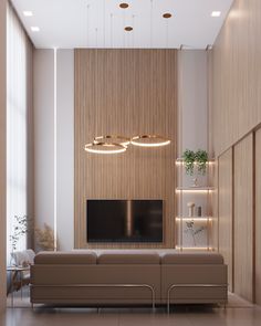 a living room with a couch, television and shelves on the wall in front of it