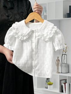 Young Girl And Toddler Girl's Casual Double-Layered Lace Ruffle Collared Shirt In Special Bubble Texture Fabric, White, Perfect For Summer Outings, Day-To-Day Wear And Vacations. Matches Well With Various Casual Trousers And Skirts. White Cute  Short Sleeve Polyester Plain Shirt Non-Stretch Spring/Summer Young Girls Clothing, size features are:Bust: ,Length: ,Sleeve Length: Cotton Blouse With Ruffles And Doll Collar, White Cotton Shirt With Doll Collar, White Cotton Doll Collar Shirt, Short Sleeve Cotton T-shirt With Ruffles, Toddler Girl White Shirt, Bubble Texture, Ruffle Collar Shirt, Texture Fabric, Plain Shirt