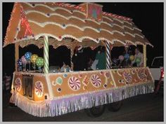 an elaborately decorated vehicle with lights and decorations on it's roof is driving down the street