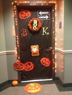 a door decorated with halloween decorations and lights