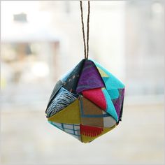 a multicolored ornament hanging from a string