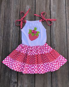 Strawberry Polka Dot Dress This cute custom boutique Strawberry dress would be great to wear to a strawberry festival or a strawberry theme birthday party. Dress is hot pink and red white polka dot with a strawberry applique on front and shoulder ties to keep fitted. Your baby girl will love twirling around in this Strawberry dress. Perfect For Pictures Strawberry Theme 100% Cotton Wash Warm tumble dry low iron if needed Made To Order MADE IN USA Strawberry Theme Birthday, Strawberry Applique, Bug Clothing, Strawberry Outfit, 2023 Crafts, Strawberry Theme, Strawberry Festival, Girls Closet, Strawberry Dress