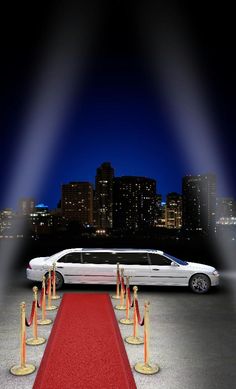 a white limo parked in front of a red carpet