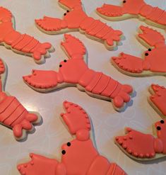 some cookies that are shaped like alligators on a table