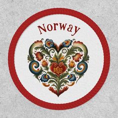 a red and white circle with the word norway painted on it's center piece