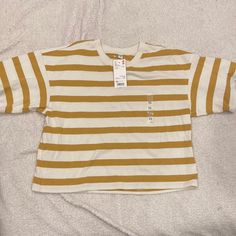 Mustard And White Striped Tee. Never Worn With Tags! Says Xs Bur Could Fit Up To A Medium. Uniqlo Long Sleeve Cotton Shirt, Uniqlo Cotton Long Sleeve Shirt, Uniqlo Relaxed Fit Crew Neck T-shirt, Uniqlo Cotton Long Sleeve Tops, Uniqlo White Cotton Tops, Uniqlo Cotton Casual Tops, Uniqlo Long Sleeve Cotton Top, Uniqlo White Crew Neck T-shirt, Uniqlo Relaxed Fit Crew Neck Top