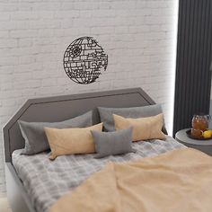 a bedroom with a bed, nightstand and wall decal in the shape of a globe