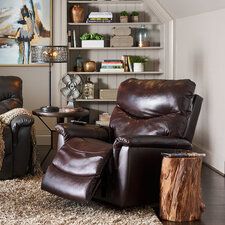 a living room with two leather recliners in it