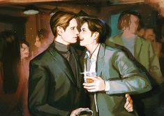 two people standing next to each other with drinks in their hands and one person kissing the other