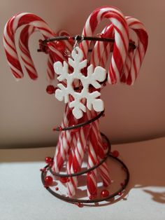 some candy canes and snowflakes on a table