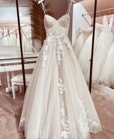 a wedding dress on display in a store