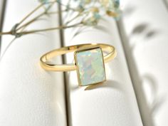 Genuine Rectangle White Opal Ring For Women, Simple Opal Birthstone Ring For Sister, Real Opal Band Ring For Wedding This stunning Opal Ring is a unique and dazzling accessory. Handcrafted from Sterling silver and/or Gold, it features a beautiful Opal Stone in the center. The elegant 22K gold plating is done by hand, giving it a brilliant shine. Our handcrafted jewelry is made to last and can be worn everyday for that eternally beautiful look! What does this ring symbolize? It is a symbol that t Rectangular Birthstone Ring For Wedding, Rectangular Birthstone Wedding Ring, Gold Crystal Ring With Rectangular Stone For Wedding, Rectangular Gold Birthstone Ring For Wedding, Gold Wedding Ring With Rectangular Stone, Wedding Crystal Ring With Rectangular Gemstone, March Stone, Opal Birthstone Ring, Opal Band Ring