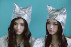 two young women wearing silver cat ears on their heads