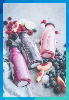 some fruit and ice cream are sitting on the ground next to berries, lemons, and raspberries