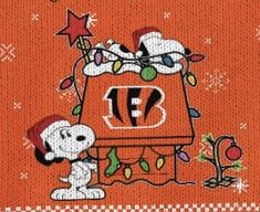 a snoopy christmas sweater with a cartoon character on it