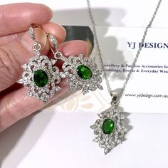 "A unique emerald green bridal jewelry in Victorian wedding style featuring vintage style Damask bridal earrings and Fleur de Lis necklace pendant, made of high quality cubic zirconia in white gold silver rhodium tarnish-resistant finish. You may choose earrings only, necklace only or earrings necklace set. Earrings are 1 1/2\" (4cm) with hooks. Pendant is about 1 3/8\" (3.5cm) with bail. Chain length is 17.5\" (45cm). * Necklace pic on mannequin is the same design but in blue for display purpos Anniversary Jewelry Sets With Matching Pendant Earrings, Elegant Green Pendant Bridal Necklace, Elegant Pendant Earrings For Wedding, Elegant Pendant Jewelry Sets For Wedding, Elegant Wedding Pendant Earrings, Wedding Diamond Pendant Jewelry Sets, Cubic Zirconia Pendant Jewelry Sets For Wedding, Diamond Pendant Jewelry Set For Wedding, Elegant Green Sterling Silver Bridal Necklace