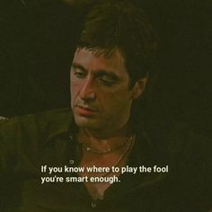 a man sitting in front of a tv screen with the words if you know where to play the fool, you're smart enough