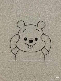 a drawing of a teddy bear on the wall