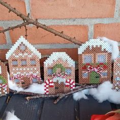 several gingerbread houses are decorated with candy canes