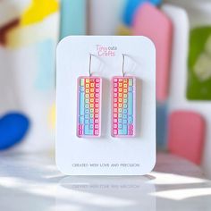 Keyboard earrings featuring a colorful pastel design, perfect for quirky gamers and tech enthusiasts who love something fun and weird. These cute acrylic dangle earrings are shaped like a keyboard with vibrant pastel colors, adding a playful and quirky touch to any outfit. Lightweight and comfortable, they're ideal for everyday wear or as a funny accessory for special occasions. A great gift idea for gamers or anyone who loves tech-themed, weird, and quirky jewelry.  Made with stainless steel findings for sensitive ears, available with two options: hooks or ball posts in gold tone or silver. Measuring approximately 1.75 to 2 inches depending on the findings chosen. Earrings come in a gift bag with a polishing cloth:) safely packaged in a shipping box.  Please contact me with any questions. Trendy Pastel Earrings For Gift, Pastel Gamer, Weird Earrings, Crazy Earrings, Kidcore Aesthetic, Pastel Design, Novelty Earrings, Tech Jewelry, Quirky Jewelry