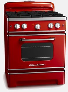 a red stove top oven sitting on top of a white floor next to a wall