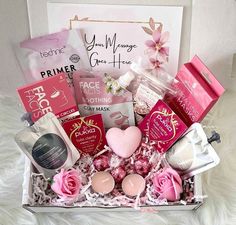 a pink gift box filled with lots of love and goodies for valentine's day