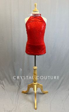 Red zsa zsa halter top with mock neck. V back with Nude horizontal strap. Paired with Red trunks. 1.5 Gross of Crystal 12ss, 16ss and 30ss Rhinestones! **Costume in image is a YL, Photographed on a YM/YL Mannequin with Measurements of: Bust 27", Waist 24", Hip 27", Girth 47" Red Triangle Halter Top For Party, Red Gold Rhinestone Dress, Red Sleeveless Dress With Rhinestones, Red Fitted Halter Top With Built-in Bra, Red Halter Neck Swimwear With Built-in Bra, Trio Costumes, Sequin Jewelry, Costumes Couture, Zsa Zsa