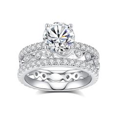 a white gold diamond engagement ring set with matching band and round brilliant cut center stone