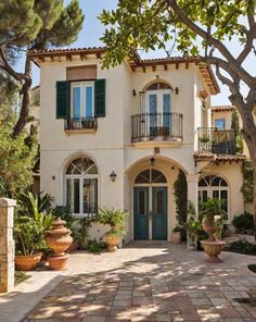 a large white house with green shutters