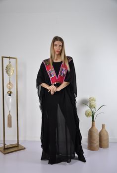 "This kaftan with the vintage embroidery v-neck and transparent chiffon fabric is great to wear over some jeans and t-shirt to look extremely flashy and bohemian. Fabric : 100% chiffon Size : Free sized dress. This Kaftan is a free sized dress meaning that it comes in one size only that fits any size from a small up to a 4XL US (Size 30) . It is designed to take the shape of and drape beautifully on any body type. Kaftan Measurements : Bust and hips - 74 inches Length : 57 inches For reference, Summer Party Kaftan With Floral Embroidery, Summer Party Embroidered Kaftan, Embroidered Summer Party Kaftan, Embellished Tunic Kaftan For Festival, Traditional Kaftan With Kimono Sleeves For Party, Bohemian Embellished Tunic Kaftan, Festival Embellished Tunic Kaftan, Bohemian Embellished Kaftan For Eid, Embellished Long Sleeve Kaftan For The Beach