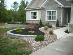 a house with landscaping in front of it