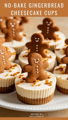 some cupcakes with icing and gingerbread on them are sitting on a plate