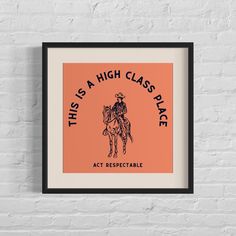 an orange and black framed poster with the words, this is a high class place