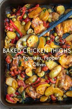 baked chicken thighs with potatoes, peppers and olives in a casserole dish