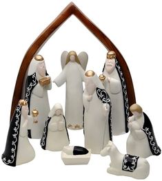 a nativity scene with figurines in white and black