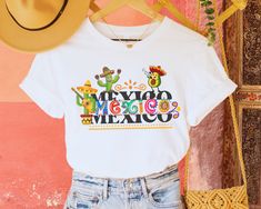 Our Mexican T-shirt will undoubtedly highlight your patriotism, it is the ideal garment to complement your wardrobe for the holidays or for any time of the year. It is the perfect gift for any Mexican or Mexican proud of their roots. Mexican birthday, Latina shirt, gift in Spanish, shirt in Spanish, Mexican gift, Mexicana gift, mother's day gift, patriotic month gift, September 16, Cinco de Mayo, love for Mexico, long live Mexico, gift Christmas, birthday gift, Cinco de Mayo gift, Cinco de Mayo shirt 👉 Unisex T-shirt. Bella-Canvas This classic unisex knit short sleeve t-shirt fits like a well-loved favorite. The soft cotton and quality print make users fall in love with it again and again. These t-shirts have ribbed knit collars to reinforce the shape. The shoulders have tape for a better Multicolor Graphic Print Tops For Independence Day, Cotton Tops With Graphic Print For Cinco De Mayo, White Custom Print Top For Independence Day, Cotton Tops With Custom Independence Day Print, Independence Day Cotton Tops With Custom Print, White Letter Print Tops For Cinco De Mayo, White Graphic Print Tops For Cinco De Mayo, White Crew Neck Shirt For Cinco De Mayo, Independence Day Crew Neck Top With Custom Print