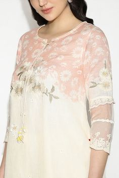 Off white and blush pink tunic with hand embroidery of anchor and silk threads embossed on top of screen-printed daisy flowers, highlighted with 3d flowers, with handmade daisy tassels dangling over the neck and sleeves. Paired with a pant with scallop embroidered lace. - Aza Fashions Spring Wedding Straight Kurta Top, Spring Pink Kurta With Embroidered Sleeves, Spring Straight Kurta With Tonal Embroidery, Spring Festive Kurta With Tonal Embroidery, Summer Pink Kurta With Intricate Embroidery, Fly Free, Pink Tunic, Straight Kurta, Daisy Flowers