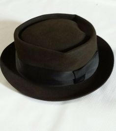 Up For Sale is a Vintage Mallory Pork Pie Style  Felt Hat...No Size Tag In The Hat But It Measures on The Sweat Band inside 22" 1/2 So The Size Will Be 7" 1/8    Crown is 3.0 inches Tall...Ribbon is 2.0" inch wide and The Brim is 1.5" inches Wide.....  .MUST HAVE FOR A VINTAGE HAT COLLECTOR.  .Little Dusty Needs Some Brushing and Shaping.  ...Please view all of the pictures as they are part of the description..Thanks for looking... Sweat Band, Pork Pie, Vintage Hat, Felt Hat, Brushing, Hats Vintage, Hat Sizes, Size Tag, Pie