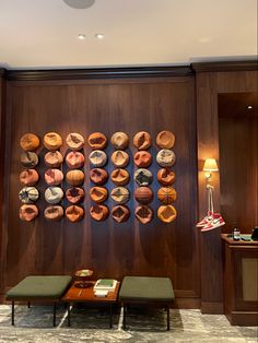 the wall is decorated with different types of donuts