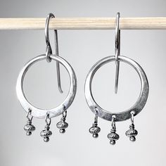 "These small dangle earrings are created entirely from solid sterling silver.  I have formed, soldered, and hammered a pair of hoops from silver.  I then I carefully wire-wrapped sparkling silver beads which dangle from the hoops in a fringe style.  The pair hangs from handmade sterling silver earwires.  The silver has been oxidized and polished to create an antique patina finish. Be sure to see all photos and video for size and color reference.   Silver Hoops: About 5/8\" Total Earring Length ( Silver Hand Forged Dangle Hoop Earrings, Silver Dangle Hoop Earrings Hand Forged, Small Dangle Earrings, Fringe Fashion, Color Reference, Patina Finish, Handmade Jewelry Gift, Silver Hoops, Handmade Sterling Silver