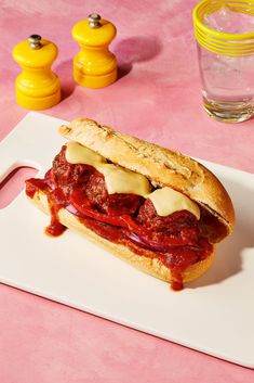 a meatball sub sandwich on a white plate