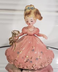 Part of the "Party Cake Topper" Series, this girl has the spot in one hand to insert a single birthday cake candle. She stands just under 4" tall in her pretty pink dress, hemmed in 24 kt gold. She is light weight, as she was made as a cake topper. Her Josef sticker is intact, although worn. She is quietly beautiful! She comes with free, first class shipping (priority shipping not available for free ship items). Birthday Candle Holder, Pretty Pink Dress, Josef Originals, Cake Candle, Birthday Cake With Candles, Candle Cake, Party Cake, 24kt Gold, The Spot