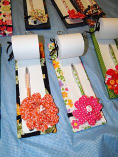 the table is set up with different items for sewing and crafting, including rolls of toilet paper