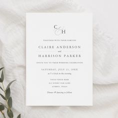 a wedding card with the letter c on it and an elegant monogrammed design