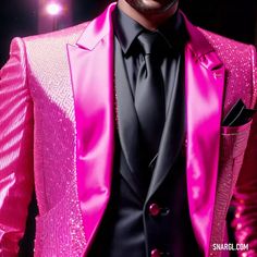 a man in a pink suit and black tie